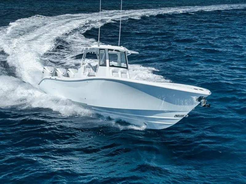 Slide: The Image of 2025 Yellowfin 36 Offshore boat cruising on open blue water. - 45