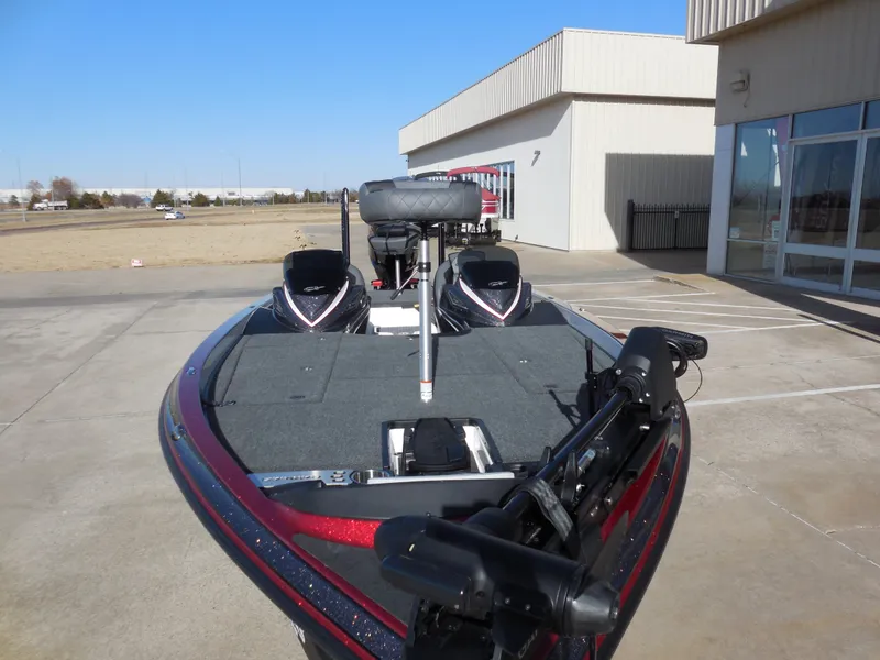 Slide: The Image of 2025 Caymas CX21Pro bass boat parked outside a building. - 9