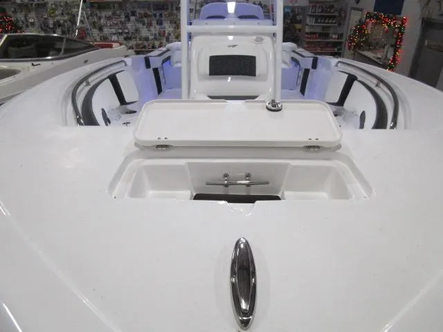 Slide: The Image of 2025 Tidewater 220 LXF boat interior with open storage compartment. - 19