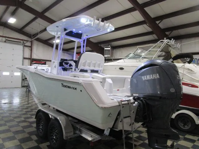 Slide: The Image of 2025 Tidewater 220 LXF boat with Yamaha engine in indoor showroom. - 21