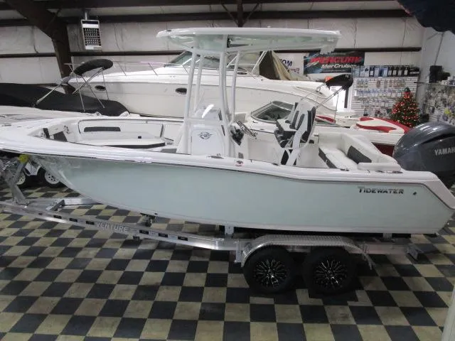 Slide: The Image of 2025 Tidewater 220 LXF boat on trailer in showroom. - 3