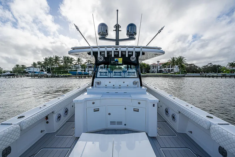 Slide: The Image of 2023 HCB 53 Sueños boat on water, featuring spacious deck and modern design. - 10