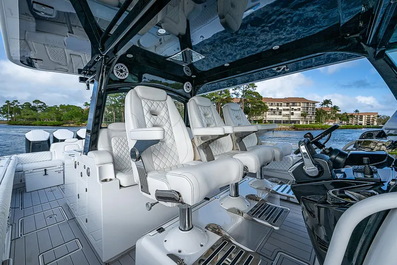 Slide: The Image of Luxurious interior of 2023 HCB 53 Sueños boat with plush seating and modern controls. - 15