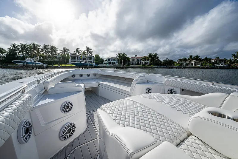 Slide: The Image of Luxurious 2023 HCB 53 Sueños boat interior with plush seating and waterfront view. - 2