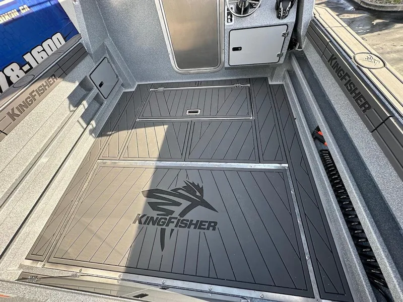 Slide: The Image of KingFisher 2725 XRS 2025 boat interior with branded flooring and sleek design. - 16