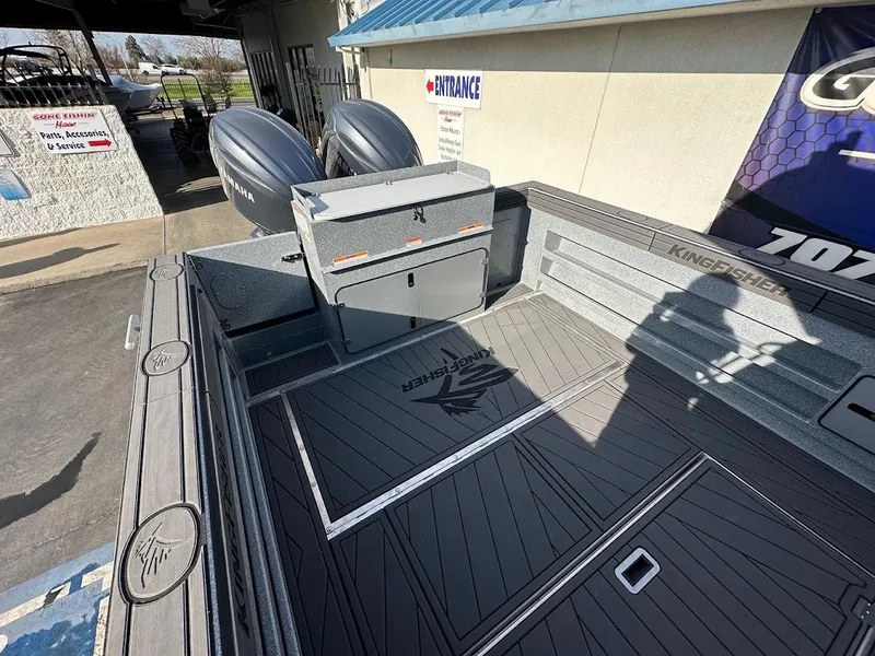 Slide: The Image of 2025 KingFisher 2725 XRS boat deck with dual engines and storage compartments. - 18