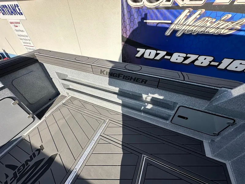 Slide: The Image of Interior view of 2025 KingFisher 2725 XRS boat with sleek design and branding. - 20