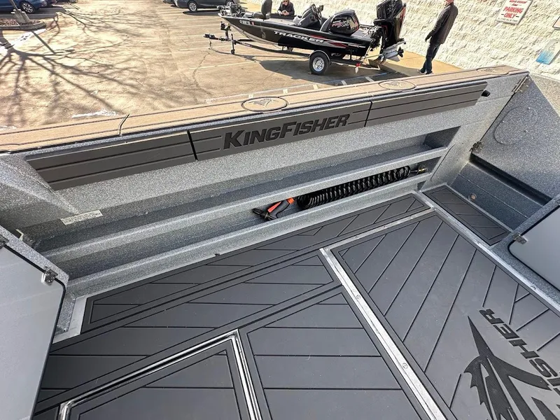 Slide: The Image of 2025 KingFisher 2725 XRS boat interior with sleek design and storage features. - 21