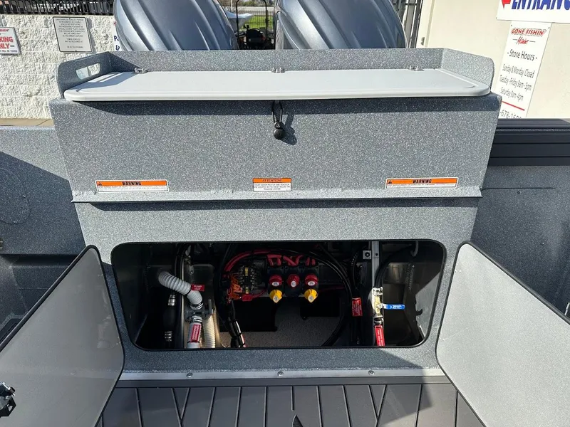 Slide: The Image of KingFisher 2725 XRS 2025 boat engine compartment with open access panel. - 28