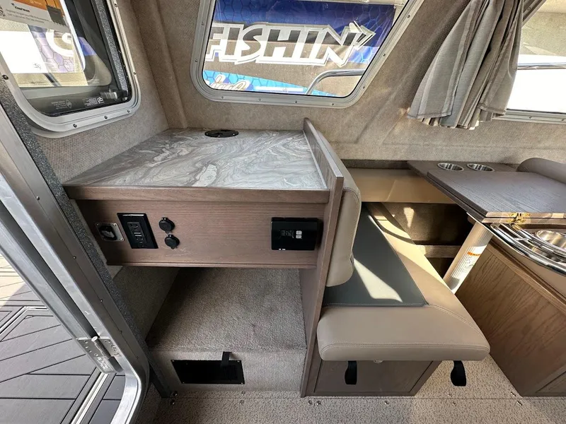 Slide: The Image of Interior of 2025 KingFisher 2725 XRS boat with seating and table. - 30