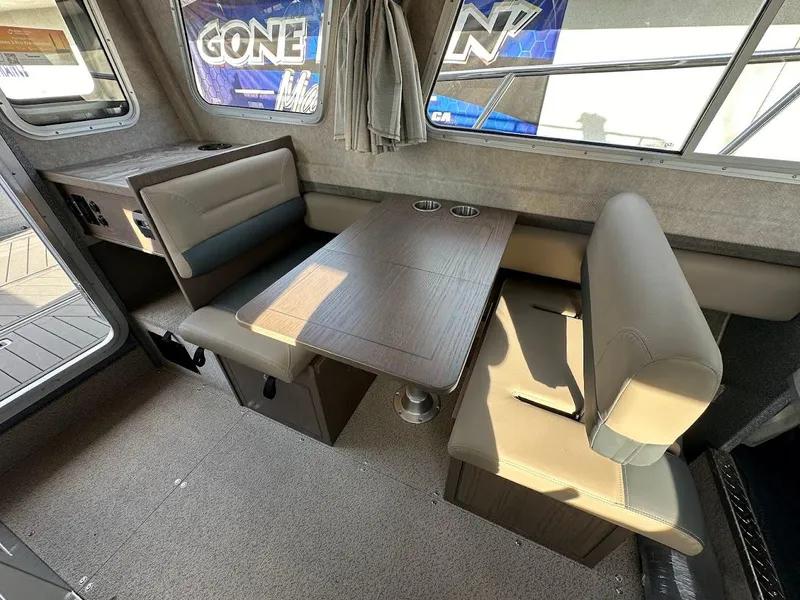 Slide: The Image of 2025 KingFisher 2725 XRS boat interior with dining area and seating. - 32