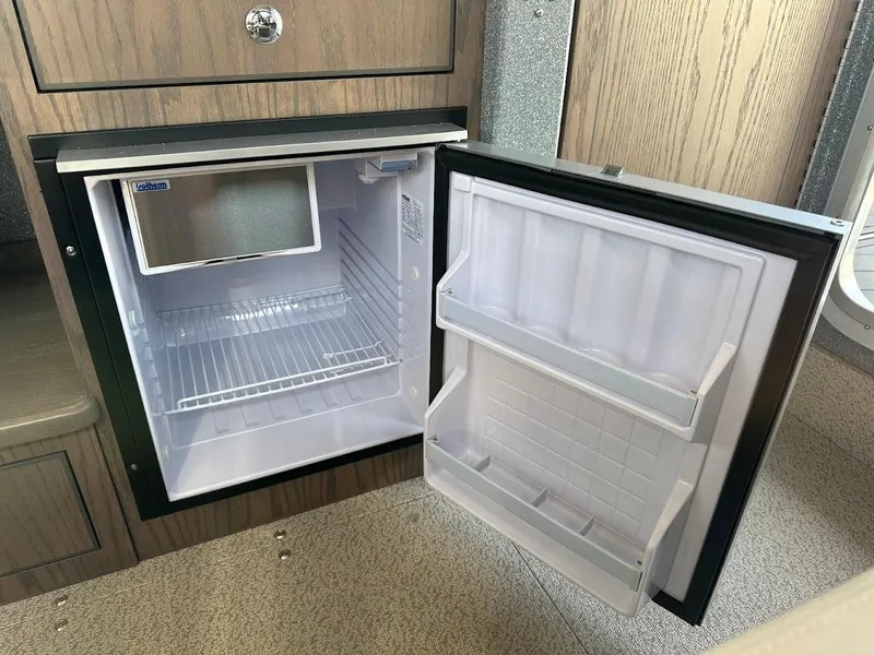 Slide: The Image of Open mini fridge in 2025 KingFisher 2725 XRS boat interior. - 45