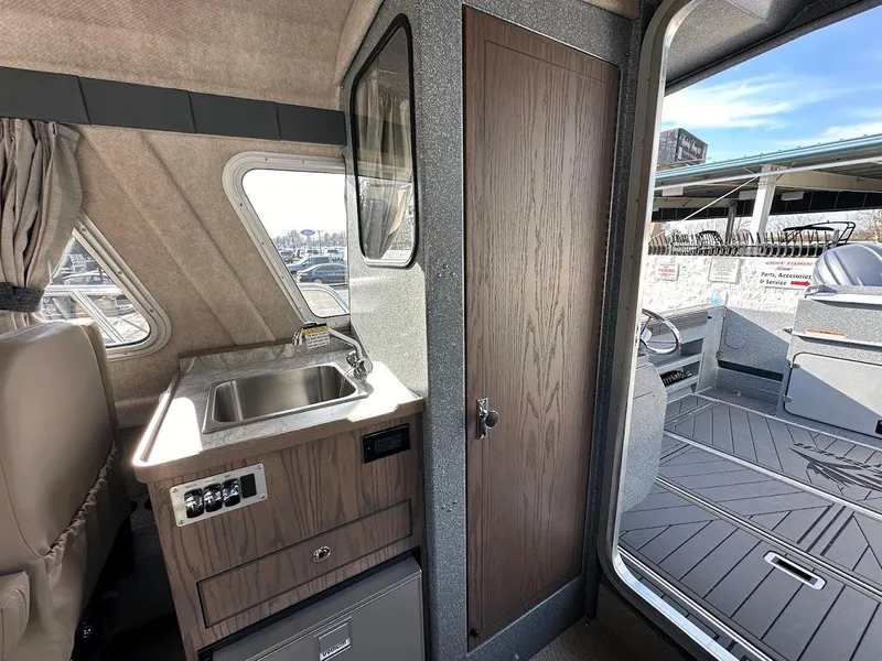 Slide: The Image of Interior of 2025 KingFisher 2725 XRS boat with sink and cabin door. - 46