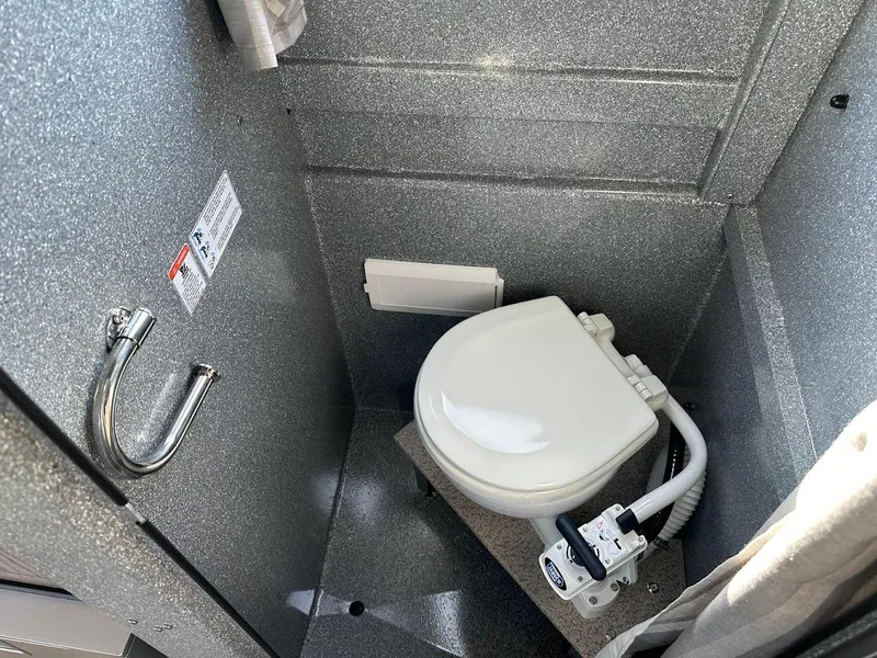 Slide: The Image of Compact bathroom in 2025 KingFisher 2725 XRS boat with modern toilet. - 48