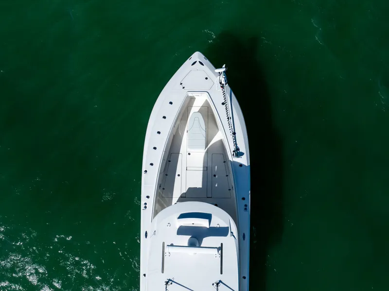 Slide: The Image of Aerial view of 2022 SeaVee 390Z boat on green water. - 9