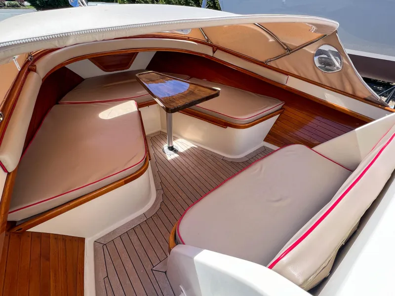 Slide: The Image of Luxurious 2003 Padebco V27 Center Console boat interior with elegant seating and wooden accents. - 20