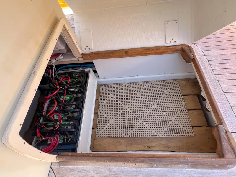 Slide: The Image of Battery compartment of 2003 Padebco V27 Center Console boat, featuring organized wiring. - 34