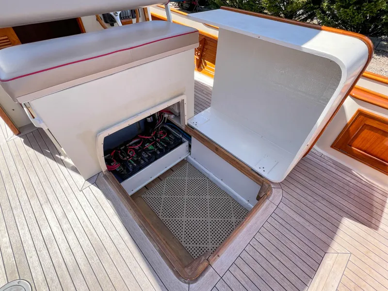 Slide: The Image of Open storage compartment on 2003 Padebco V27 Center Console boat deck. - 35