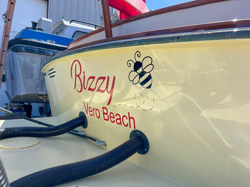 Slide: The Image of Padebco V27 Center Console 2003 boat with "Bizzy" and bee graphic, Vero Beach. - 36