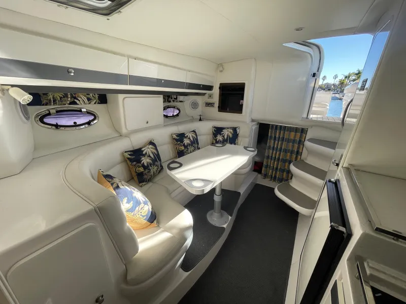 Slide: The Image of Interior of 1998 Donzi 3250 LXC boat with seating and table. - 24