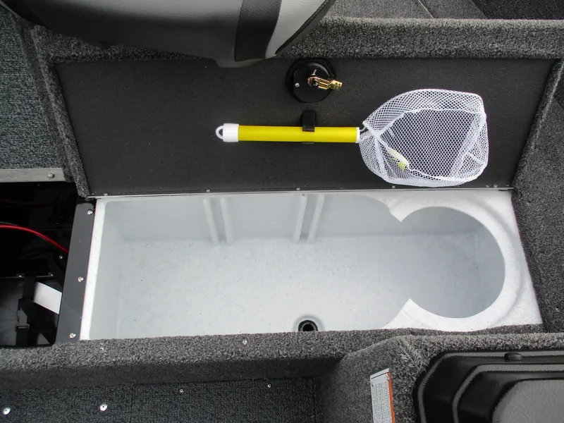 Slide: The Image of 2025 Lund Rebel XL 1650 SS boat storage compartment with fishing net and rod holder. - 12