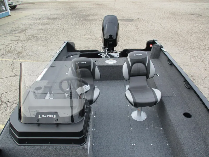 Slide: The Image of 2025 Lund Rebel XL 1650 SS boat interior with seating and console. - 6