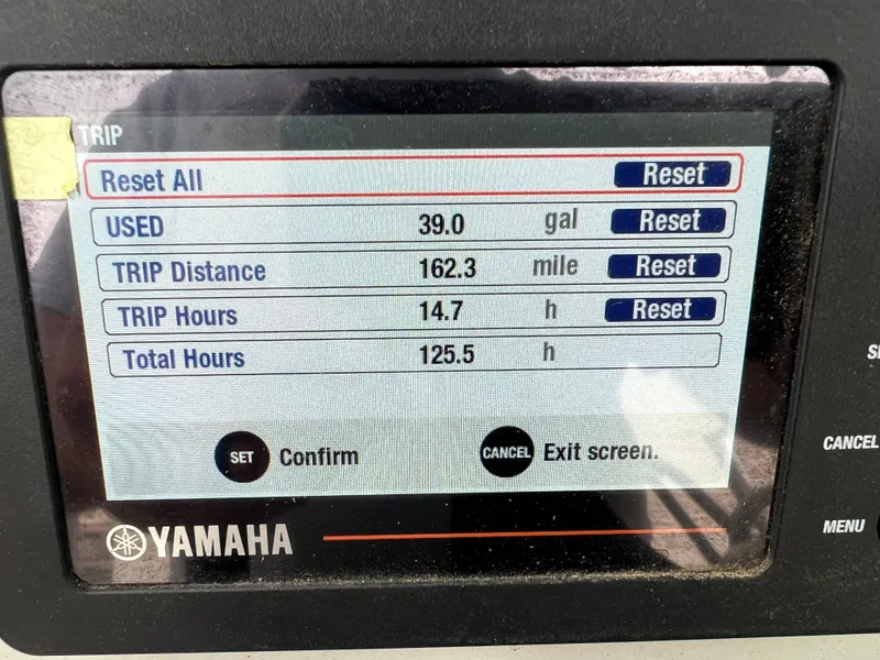 Slide: The Image of 2020 Zodiac Pro 5.5 boat dashboard with steering wheel and navigation screens. - 12