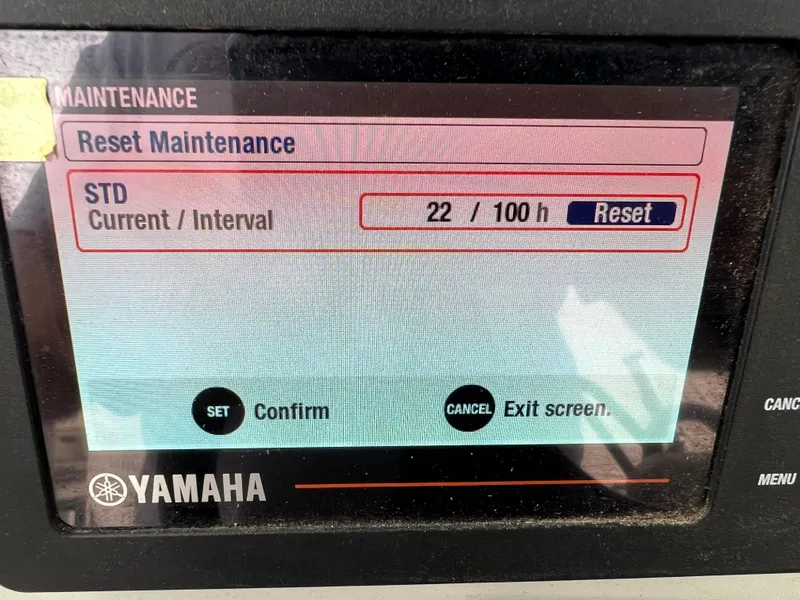 Slide: The Image of 2020 Zodiac Pro 5.5 boat with Yamaha 115 engine on water near dock. - 13