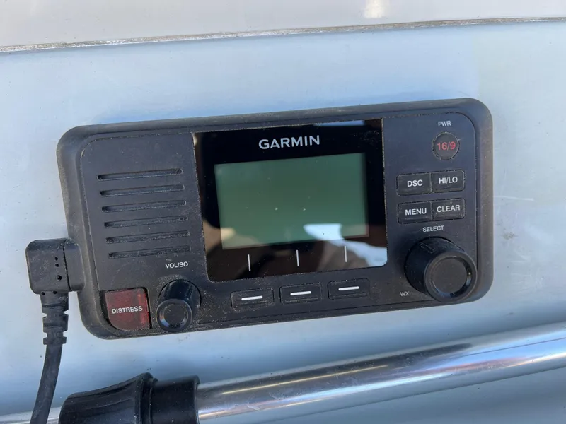 Slide: The Image of Close-up of 2020 Zodiac Pro 5.5 boat motor and trailer hitch. - 22