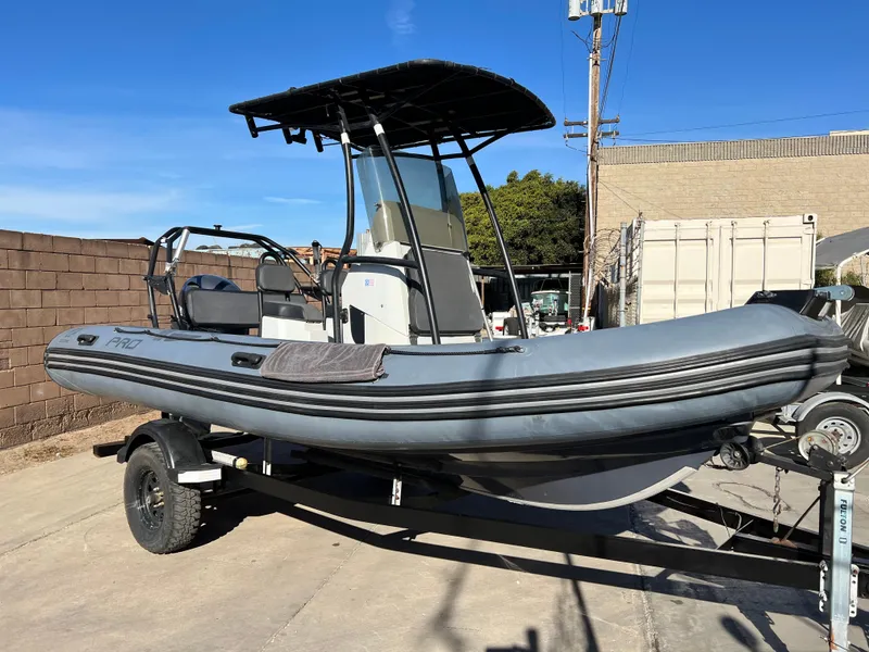 Slide: The Image of 2020 Zodiac Pro 5.5 inflatable boat on trailer in a garage setting. - 3