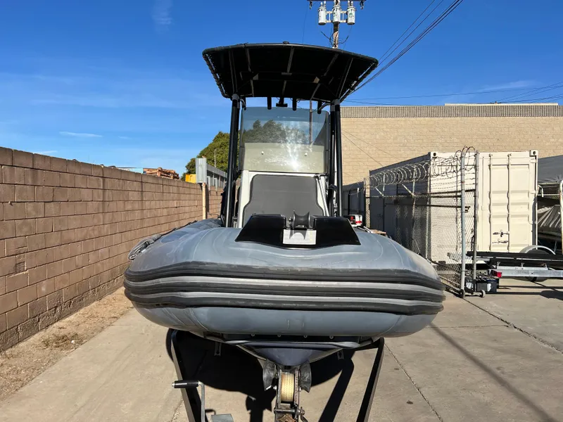 Slide: The Image of 2020 Zodiac Pro 5.5 boat with Yamaha engine in a garage setting. - 4