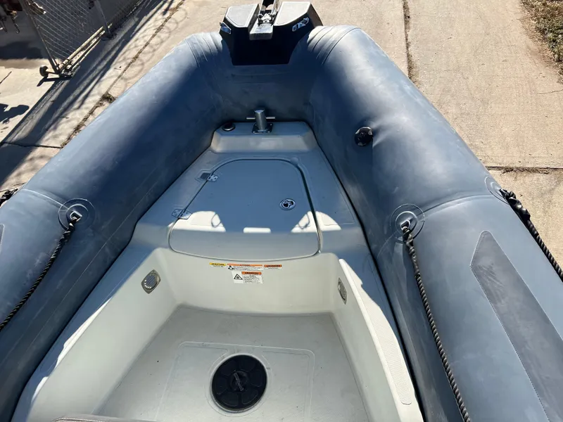 Slide: The Image of 2020 Zodiac Pro 5.5 boat on trailer in a garage setting. - 5