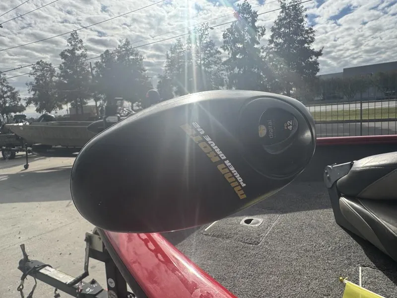 Slide: The Image of 2015 Tracker Pro Guide V-16 SC boat with Minn Kota trolling motor in sunny outdoor setting. - 9