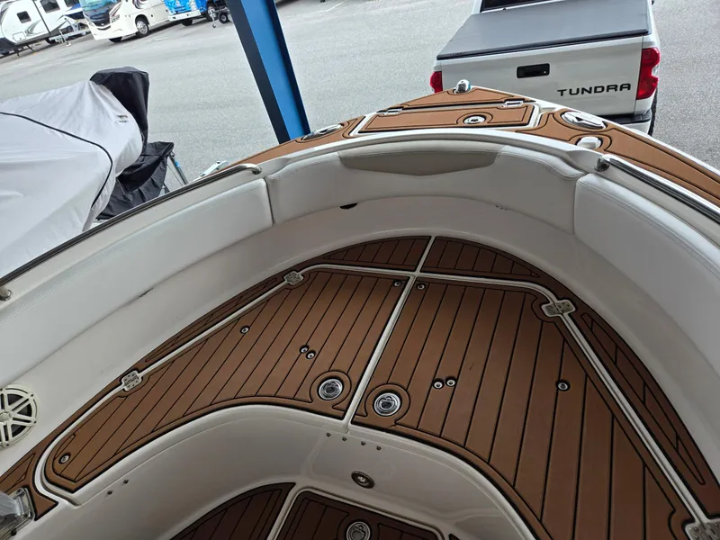 Slide: The Image of 2014 Robalo R222 Center Console boat interior with teak flooring. - 17