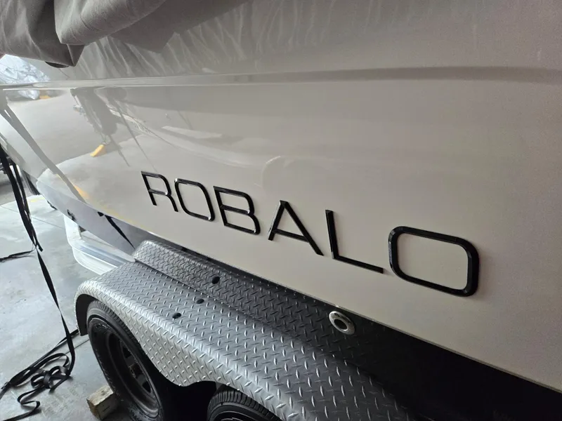 Slide: The Image of 2014 Robalo R222 Center Console boat on trailer, side view. - 19