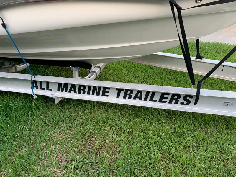 Slide: The Image of 2006 Monterey 268SS Super Sport on All Marine Trailers, parked on grass. - 10