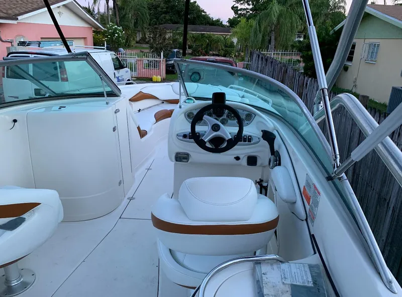 Slide: The Image of 2006 Monterey 268SS Super Sport boat interior with white seating and steering wheel. - 6