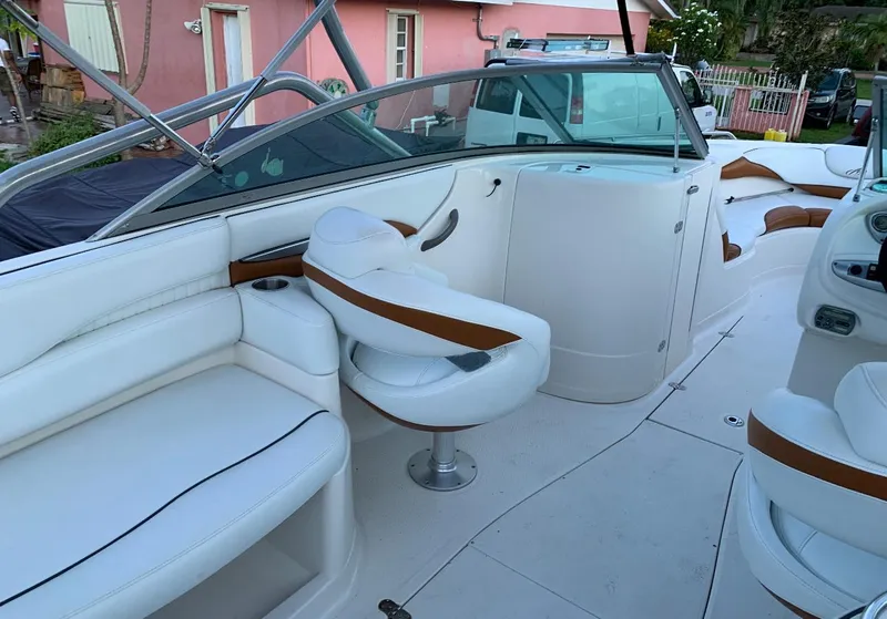 Slide: The Image of 2006 Monterey 268SS Super Sport boat interior with white and tan seating. - 7