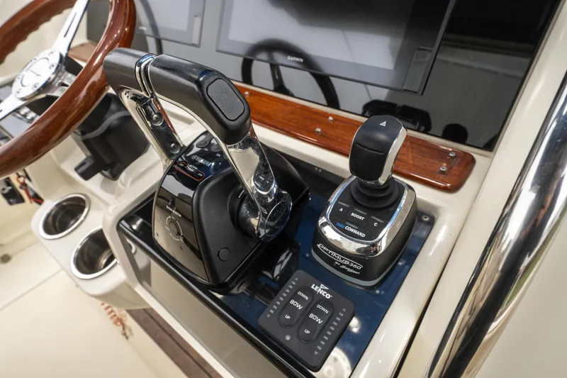 Slide: The Image of Close-up of 2018 Chris-Craft Catalina 34 helm controls and steering wheel. - 16