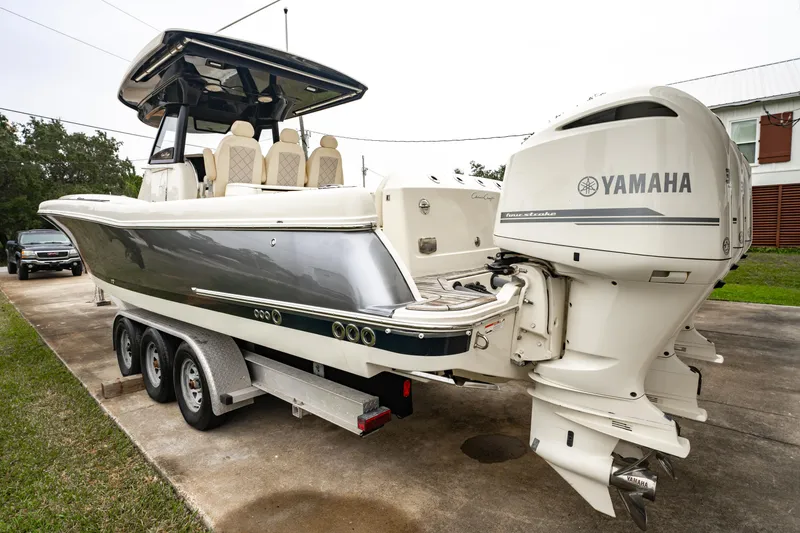 Slide: The Image of 2018 Chris-Craft Catalina 34 boat with Yamaha engines on a trailer. - 2