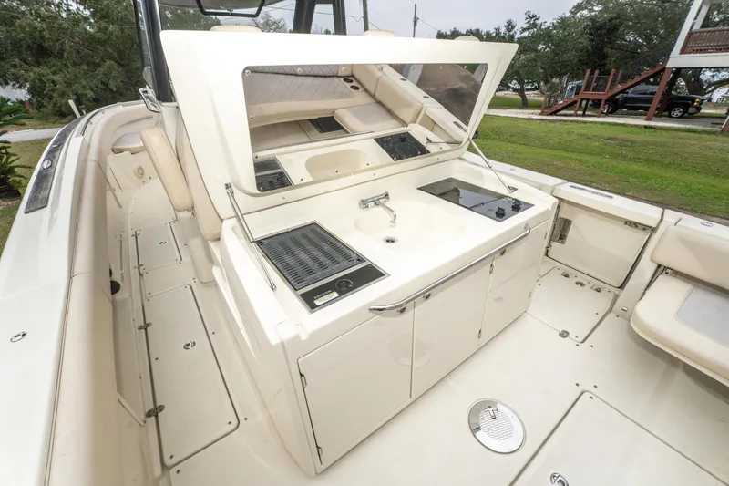 Slide: The Image of 2018 Chris-Craft Catalina 34 boat with outdoor kitchen and seating area. - 22