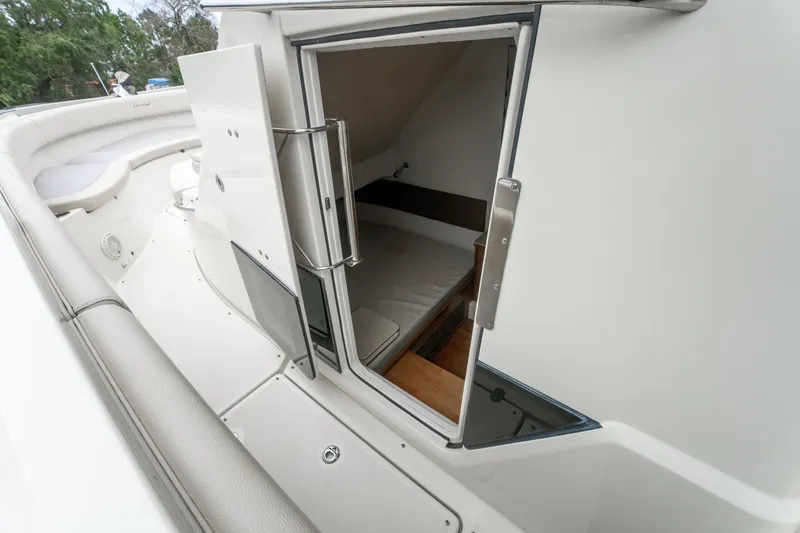Slide: The Image of 2018 Chris-Craft Catalina 34 cabin entrance with open door, showcasing interior space. - 24