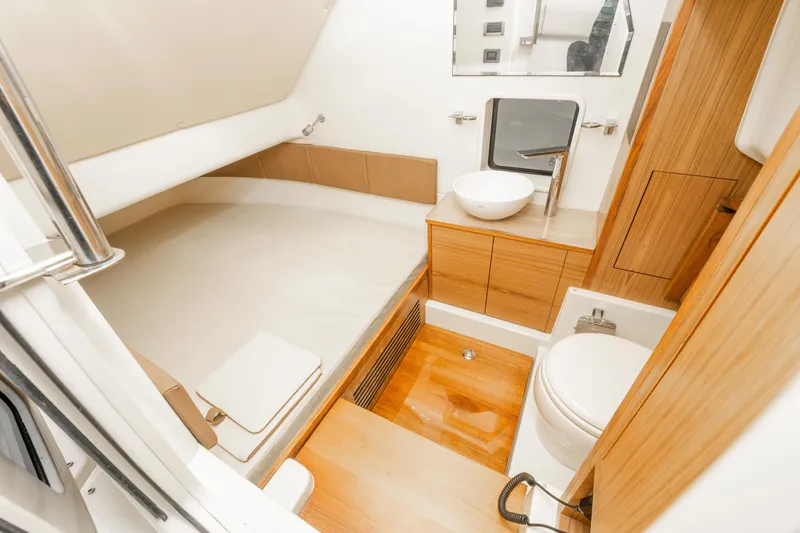 Slide: The Image of Luxurious 2018 Chris-Craft Catalina 34 cabin with modern bathroom and cozy sleeping area. - 25
