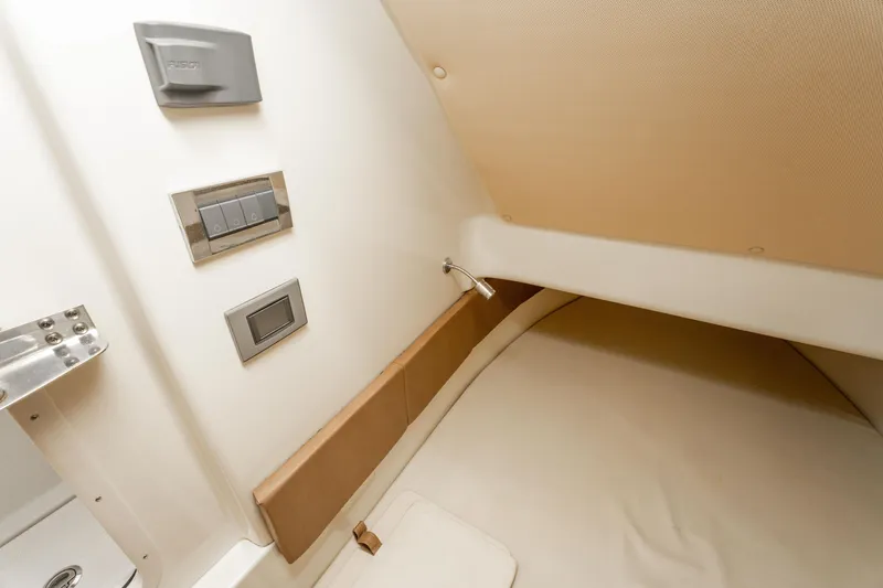 Slide: The Image of 2018 Chris-Craft Catalina 34 cabin interior with modern controls and cozy sleeping area. - 30