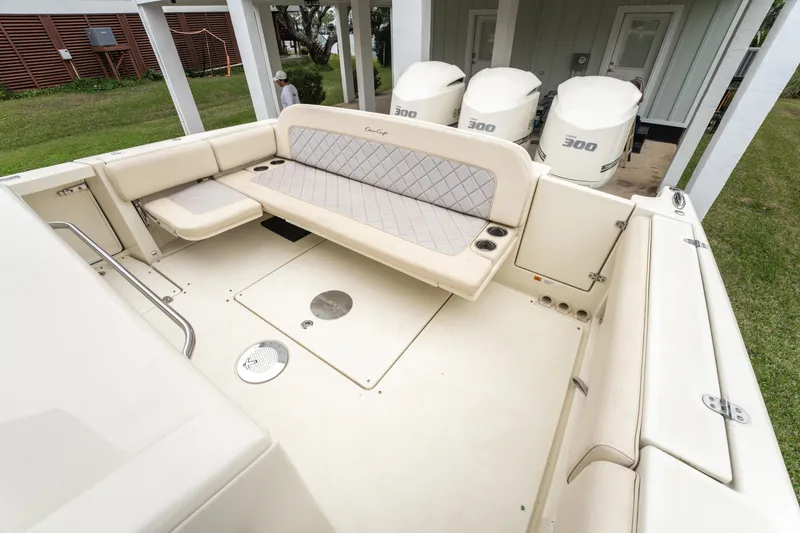 Slide: The Image of 2018 Chris-Craft Catalina 34 boat interior with seating and triple 300 horsepower engines. - 6