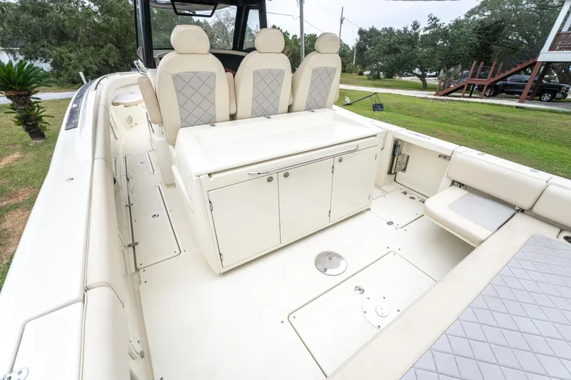 Slide: The Image of 2018 Chris-Craft Catalina 34 boat interior with seating and storage. - 7