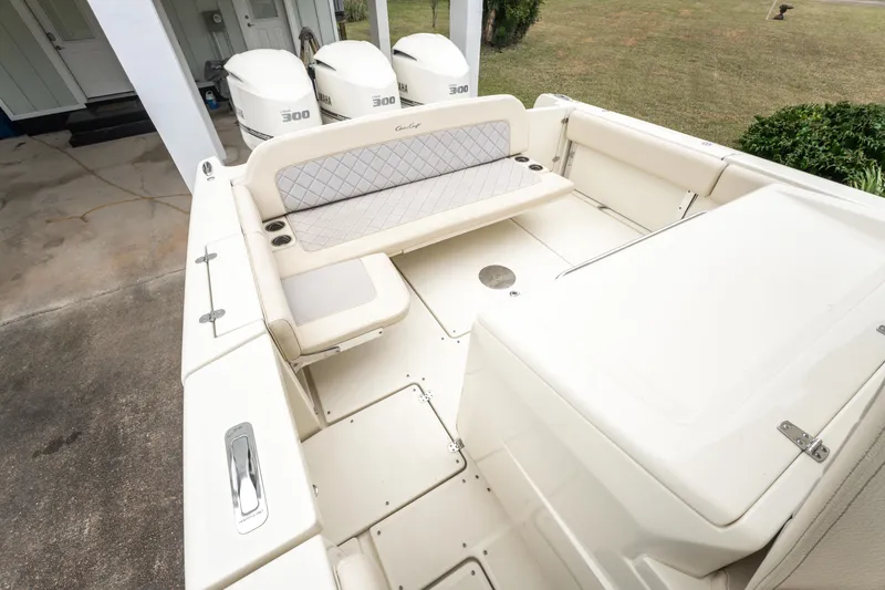 Slide: The Image of 2018 Chris-Craft Catalina 34 boat with triple outboard engines and spacious seating area. - 8