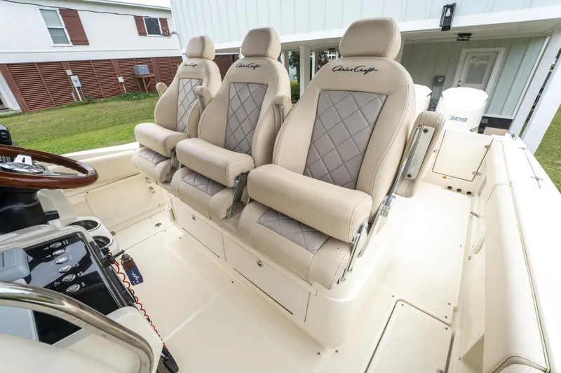 Slide: The Image of 2018 Chris-Craft Catalina 34 boat interior with luxurious beige seating. - 9