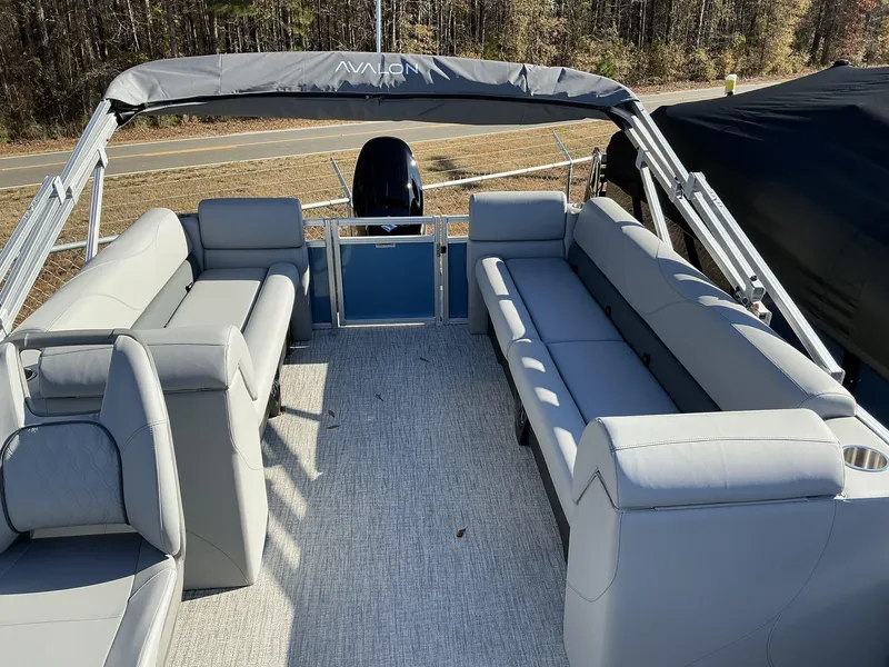 Slide: The Image of 2025 Avalon VLS 23 Quad Lounger pontoon boat with spacious seating and modern design. - 10