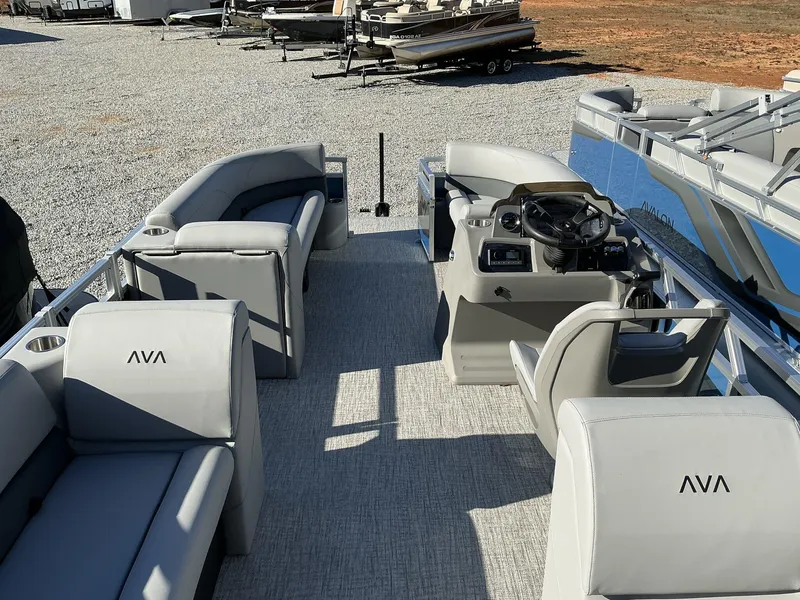 Slide: The Image of 2025 Avalon VLS 23 Quad Lounger pontoon boat interior with plush seating and modern helm. - 11